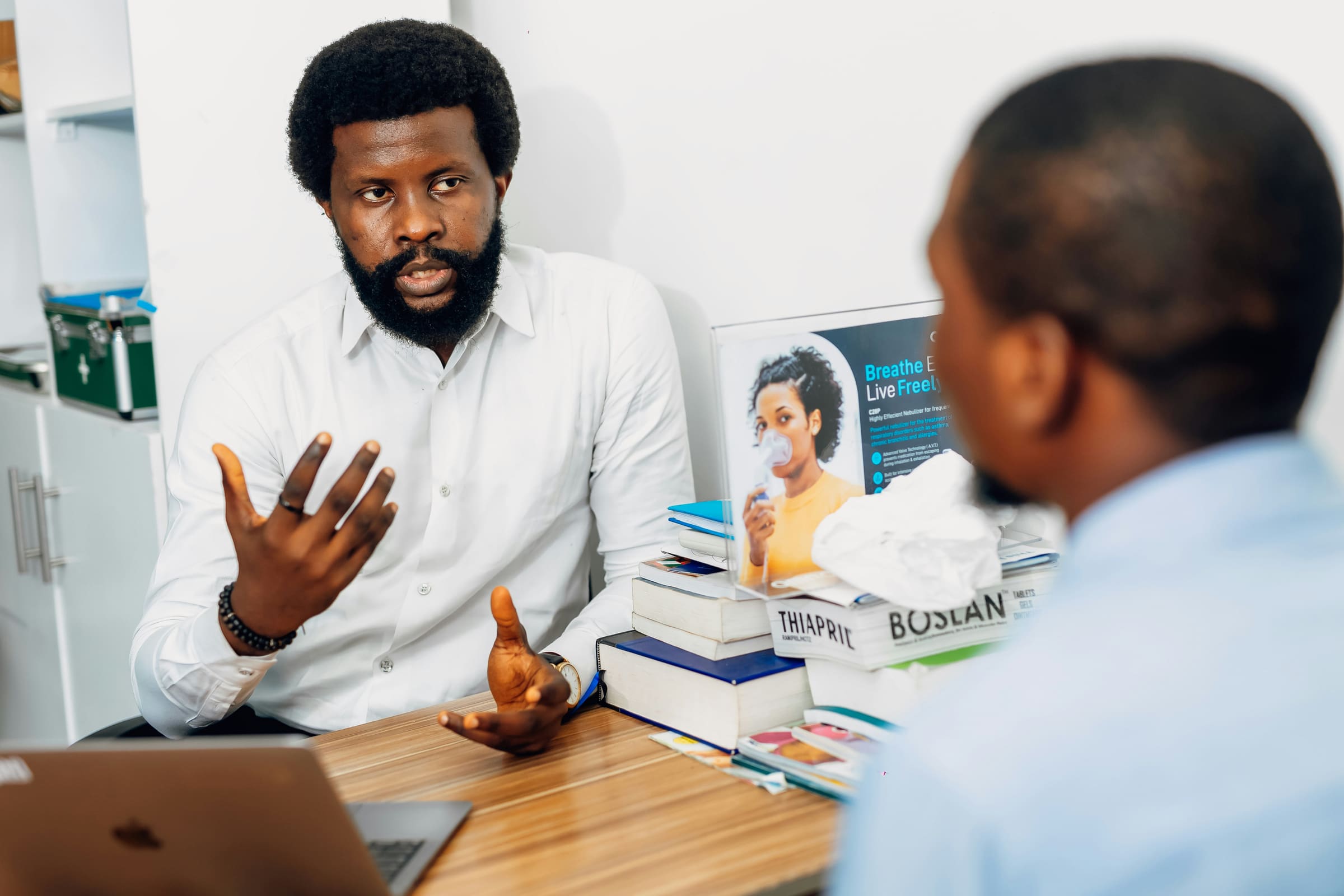 A clinician speaking with a patient